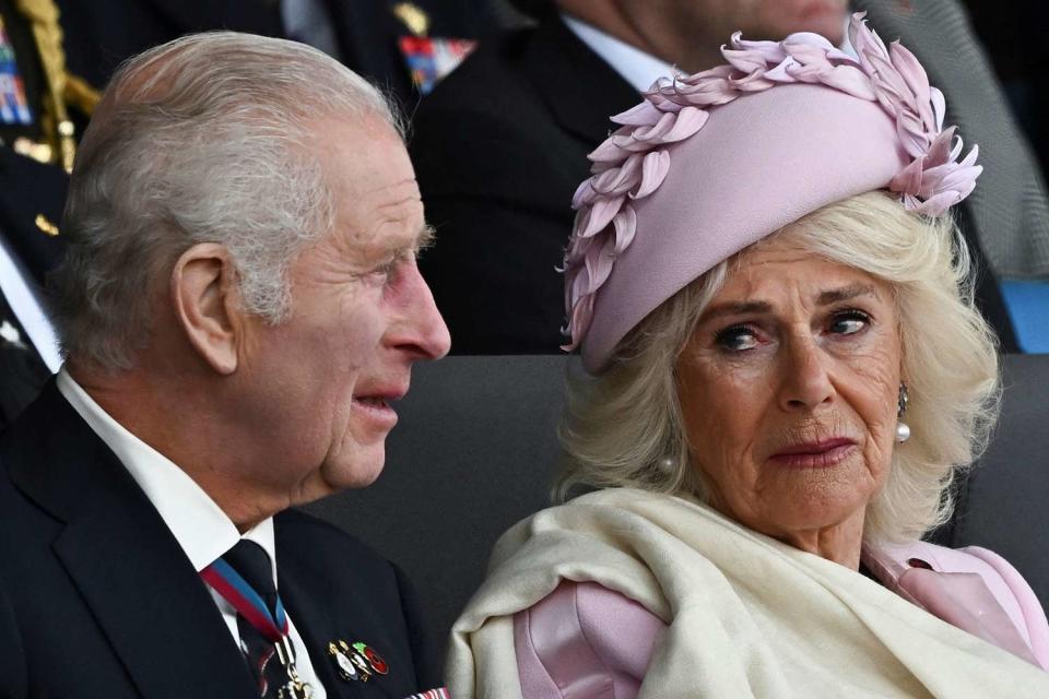 <p>DYLAN MARTINEZ/POOL/AFP via Getty</p> King Charles and Queen Camilla at the U.K.’s national commemorative event marking the 80th anniversary of the D-Day Landings in Portsmouth, England, on June 5, 2024.