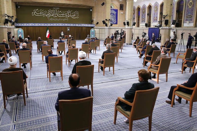 Iran's Supreme Leader Ayatollah Ali Khamenei meets with Iranian President Hassan Rouhani and his cabinet members, in Tehran