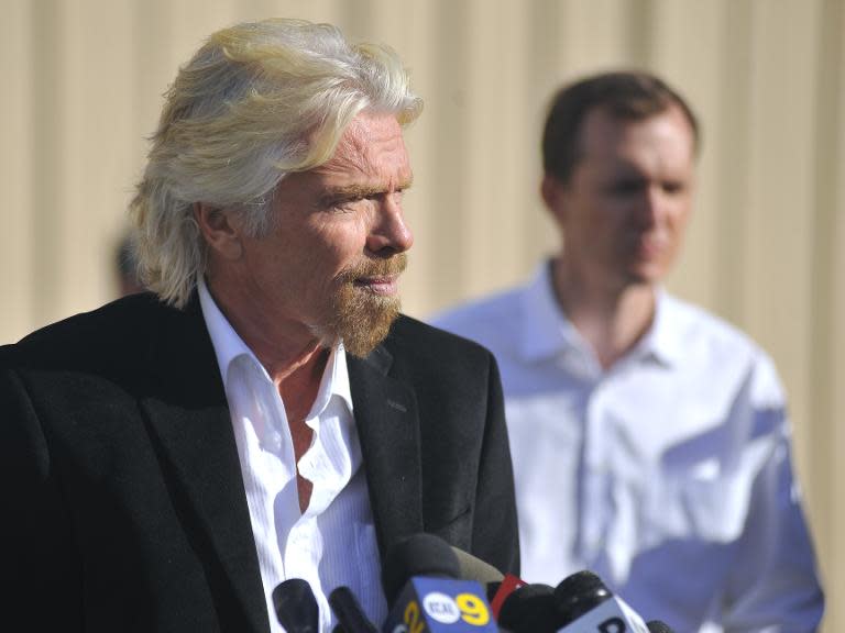 Virgin founder Sir Richard Branson speaks at a press conference at the Mojave Air and Space Port in Mohave, California on November 1, 2014