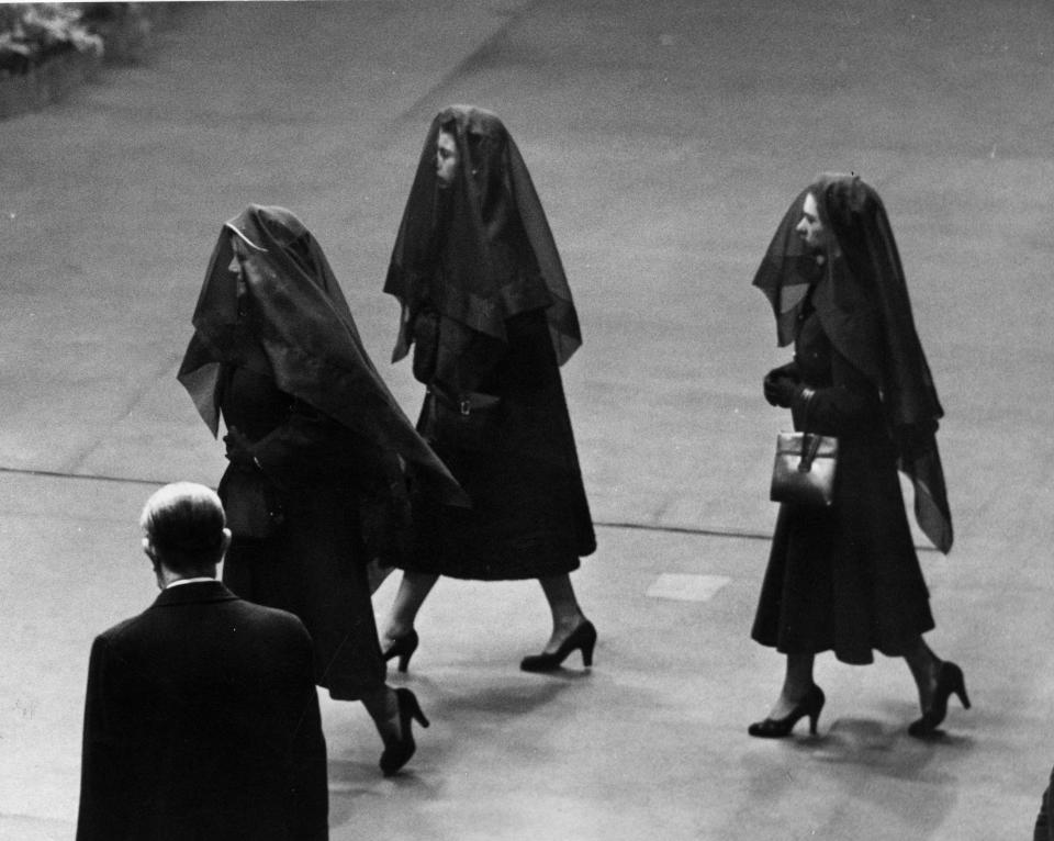 Queen Elizabeth II; her mother, Queen Elizabeth the Queen Mother; and her sister, Princess Margaret, attend the arrival of the coffin of King George VI at Westminster Hall, London, Feb. 11, 1952. / Credit: E. Round/Fox Photos/Hulton Archive/Getty Images