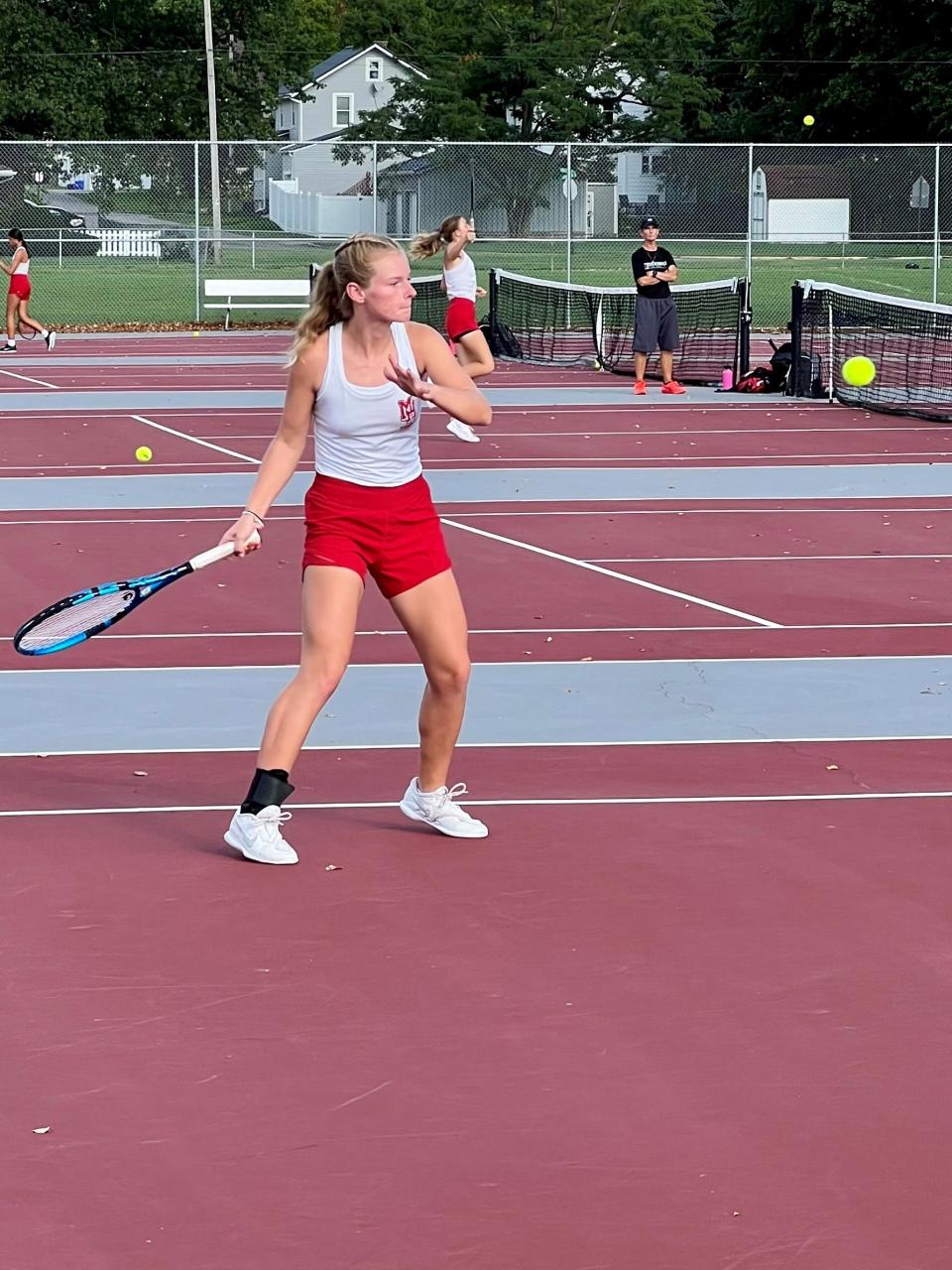 Marion Harding's Taryn Simmers returns a shot during a girls match against River Valley earlier this season at the Grant Middle School tennis courts. Simmers will try to qualify for the Division I district tournament  for a second time this weekend at sectionals.