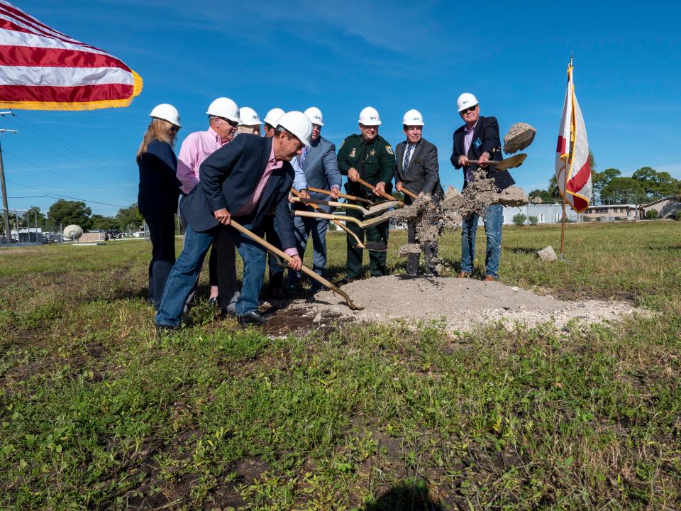 Officials join in to celebrate the start of construction on the new emergency operations center