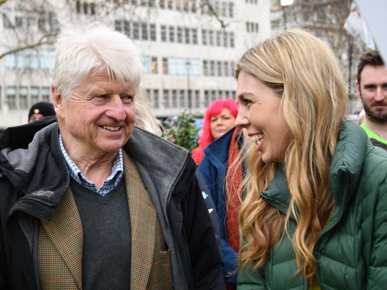 Stanley Johnson introduces himself to Carrie Symonds at an anti-whaling protest outside the Japanese Embassy in central London.