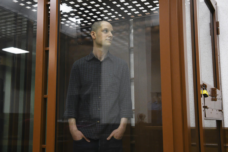 Wall Street Journal reporter Evan Gershkovich stands in a glass cage in a courtroom in Yekaterinburg, Russia, Wednesday, June 26, 2024. Fifteen months after he was arrested in the city of Yekaterinburg on espionage charges, Gershkovich returns there for his trial starting Wednesday, June 26, 2024, behind closed doors. Gershkovich, his employer and the U.S. government deny the charges. (AP Photo)