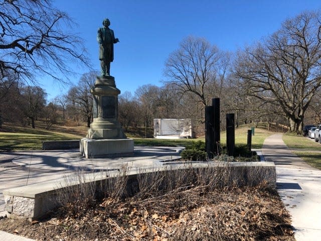 Frederick Douglass Memorial Plaza, the centerpiece of which is an 8-foot bronze statue of his likeness on a 9-foot blue granite pedestal.