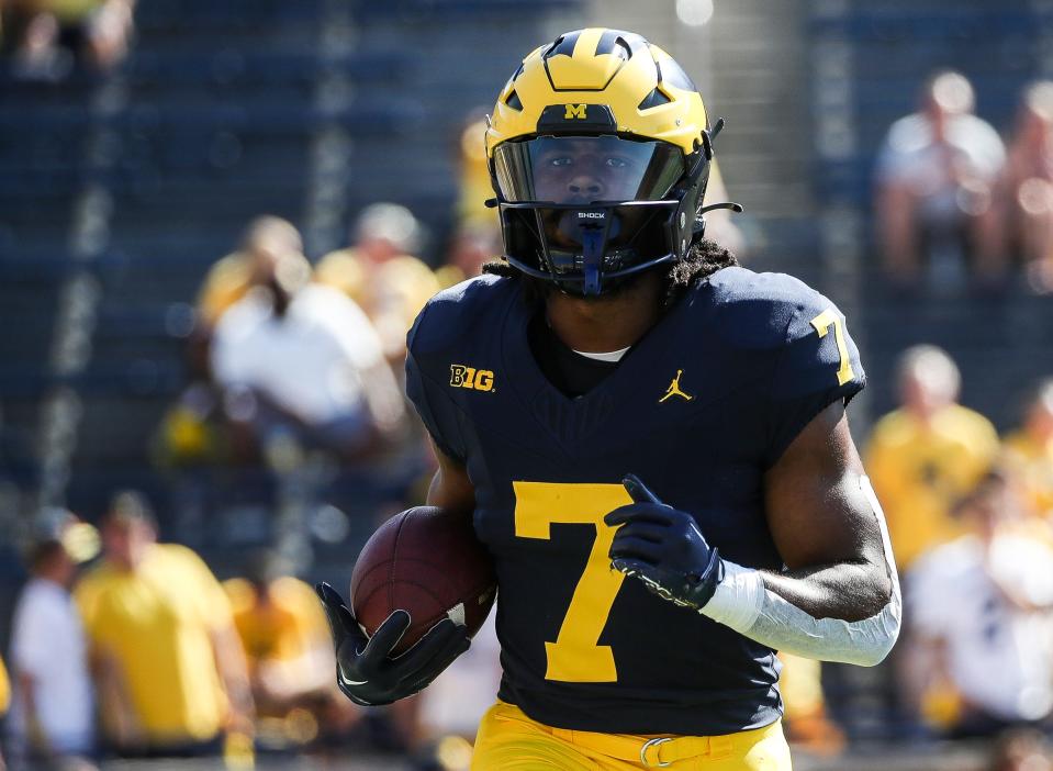 Michigan running back Donovan Edwards (7) warms up before the East Carolina game at Michigan Stadium in Ann Arbor, Saturday, Sept. 2, 2023.