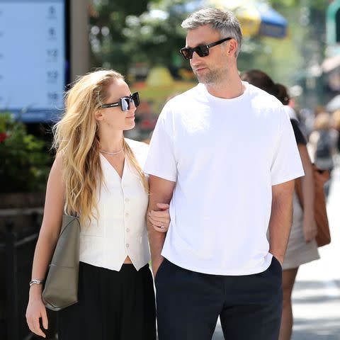 <p>Christopher Peterson / SplashNews.com</p> Jennifer Lawrence and husband Cooke Maroney take a stroll arm in arm around Central Park in New York City.