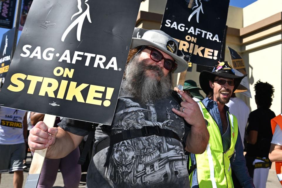 US actor Jack Black joins SAG-AFTRA members and their supporters as they walk a picket line outside Paramount Studios during their strike against the Hollywood studios, in Los Angeles, California, on November 8, 2023. The union representing striking actors said on November 6, 2023, it could not agree to studios' "last, best and final offer" issued over the weekend in a bid to end a months-long stalemate that has crippled Hollywood. (Photo by Robyn Beck / AFP) (Photo by ROBYN BECK/AFP via Getty Images)