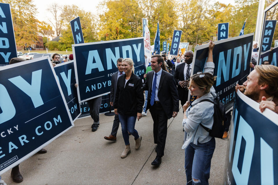 Kentucky Democratic Gov. Andy Beshear, center right, and wife, Britainy, greet supporters ahead of a gubernatorial debate with Republican Attorney General Daniel Cameron at KET Network Center in Lexington, Ky., Monday, Oct. 23, 2023. (Kentucky Educational Television via AP, Pool)