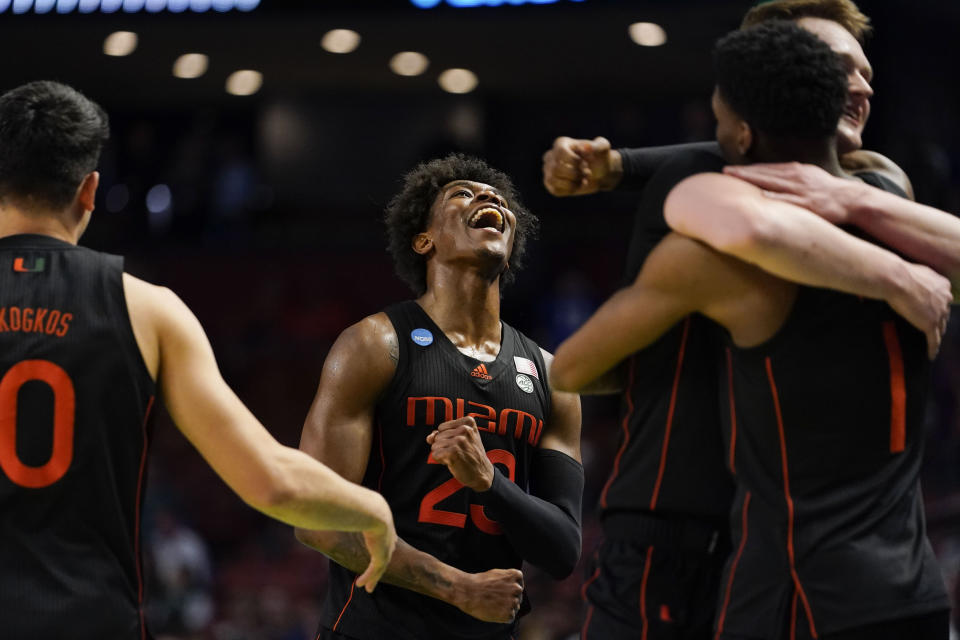 Miami's Kameron McGusty (23) celebrates after a win over Auburn in a college basketball game in the second round of the NCAA tournament Sunday, March 20, 2022, in Greenville, S.C. (AP Photo/Brynn Anderson)