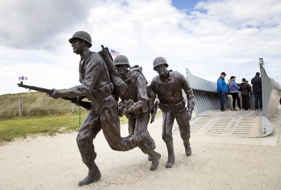 In this May 2, 2019 photo, a statue of U.S. World War II soldiers departing a replica landing craft on Utah Beach in Sainte-Marie-du-Mont, Normandy, France. A dwindling number of D-Day veterans will be on hand in Normandy in June, when international leaders gather to honor them on the invasion’s 75th anniversary. (AP Photo/Virginia Mayo)