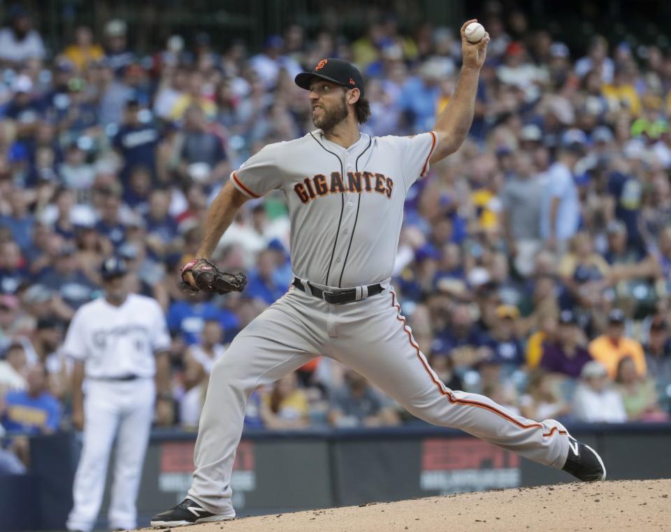 San Francisco Giants starting pitcher Madison Bumgarner throws during the first inning of a baseball game against the Milwaukee Brewers Saturday, July 13, 2019, in Milwaukee. (AP Photo/Morry Gash)