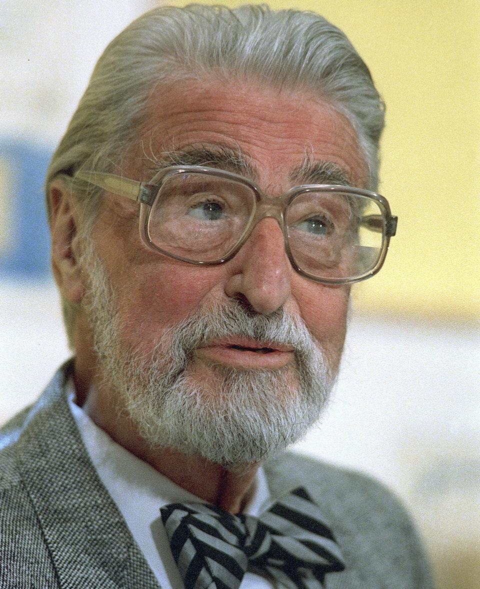 FILE - This April 3, 1987 file photo shows American author, artist and publisher Theodor Seuss Geisel, known as Dr. Seuss in Dallas, Texas. A touring immersive attraction tied to the work of the famous late author is scheduled debut in Toronto in October 2019, followed by visits to several cities in the United States. (AP Photo, File)