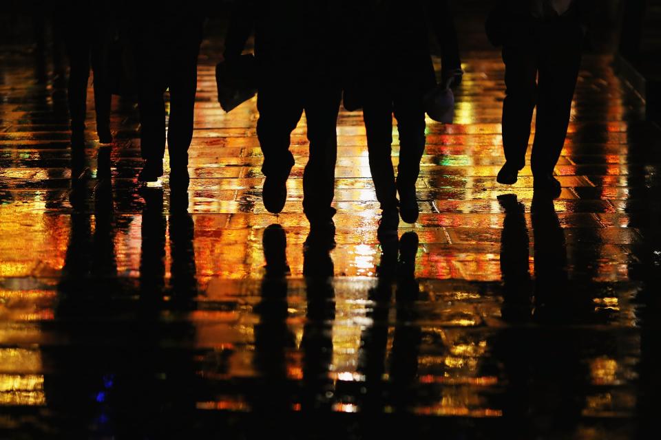 People walk down the Southbank in the rain in London. Britain is once again bracing for more floods and heavy rain (Dan Kitwood/Getty Images)