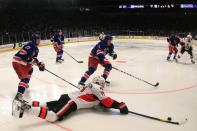 NEW YORK, NY - APRIL 26: Daniel Alfredsson #11 of the Ottawa Senators falls to the ice against the defense of Brandon Dubinsky #17 of the New York Rangers in the third period of Game Seven of the Eastern Conference Quarterfinals during the 2012 NHL Stanley Cup Playoffs at Madison Square Garden on April 26, 2012 in New York City. (Photo by Bruce Bennett/Getty Images)