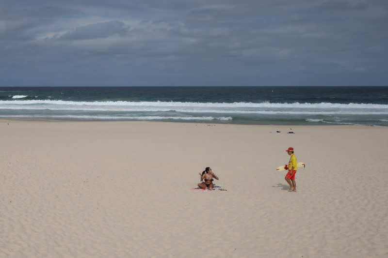 Surf rescue personnel enforce a closure of Bondi Beach to prevent the spread of the coronavirus disease (COVID-19) in Sydney