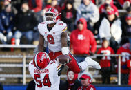 Maryland running back Tayon Fleet-Davis (8) celebrates with offensive lineman Spencer Anderson (54) after scoring a touchdown against Rutgers during the second half of an NCAA football game, Saturday, Nov. 27, 2021, in Piscataway, N.J. Maryland won 40-16. (AP Photo/Noah K. Murray)