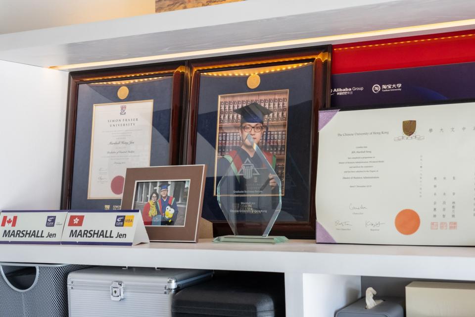Certificates and photographs of Marshall Jen, who also comes from wealth, and who now mentors other second-generation clients. (Billy H.C. Kwok/Bloomberg)