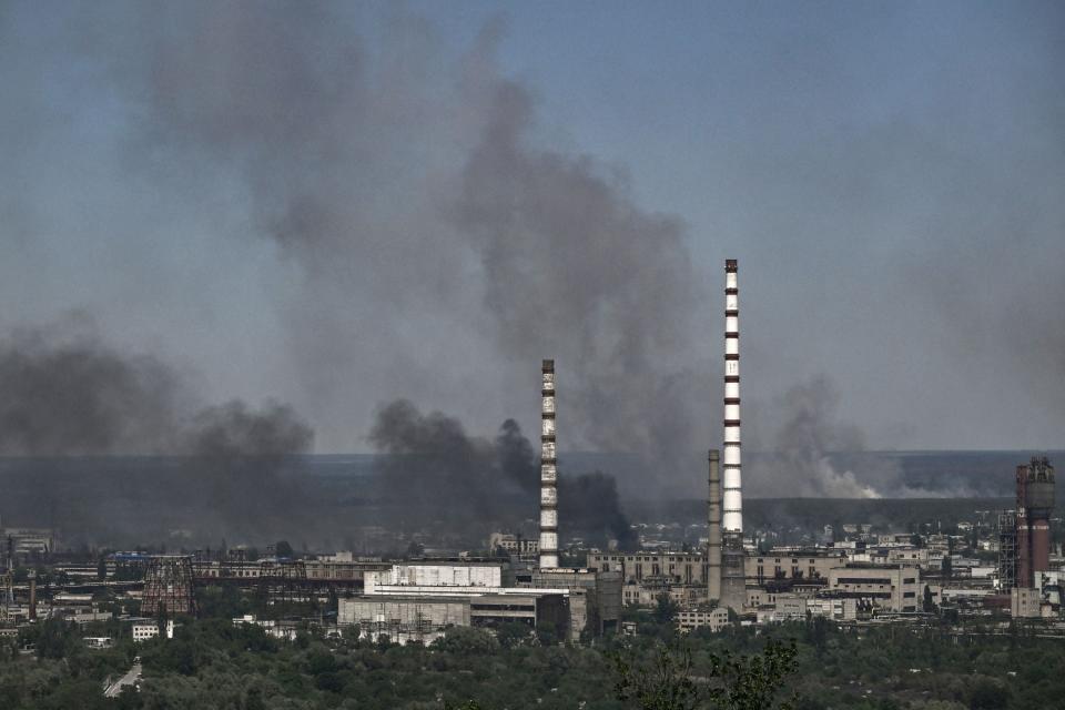 Smoke rises above the city of Sievierodonetsk in the Donbas, eastern Ukraine, on 9 June, 2022 (AFP via Getty Images)