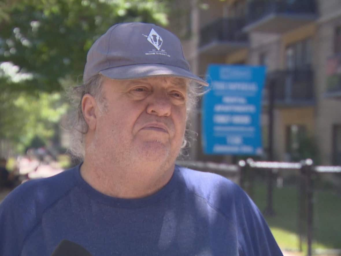 Gerald Lomond, who's lived in the building for about 10 years, says hydro was included as part of his lease agreement, but that he’s now faced with the choice of paying for it himself or finding somewhere else to live. (Oliver Walters/CBC - image credit)