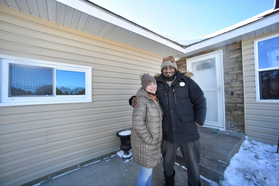 Phil and Andrea Robinson are pictured near recently repaired parts of their house Wednesday, Jan. 19, 2022, in Cold Spring.