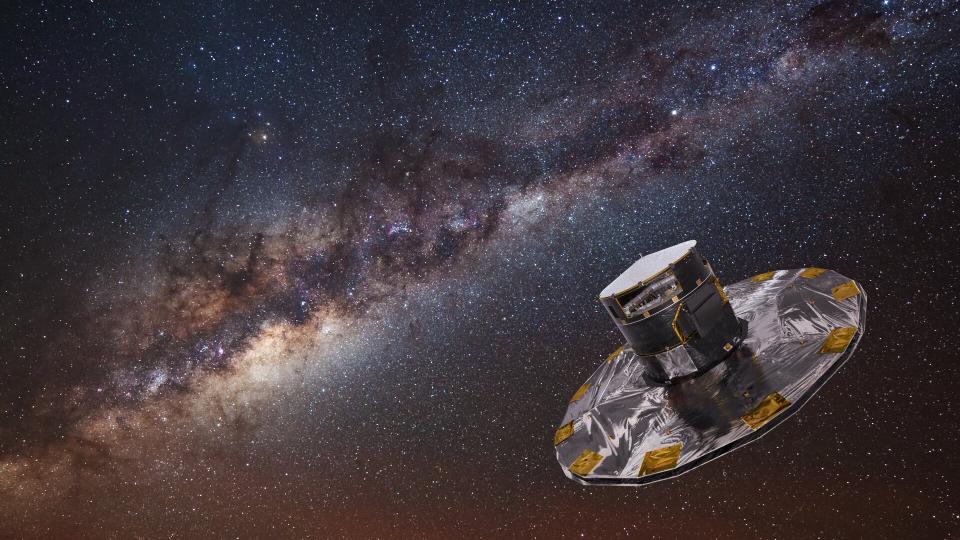  The Gaia spacecraft over a background of the Milky Way. 