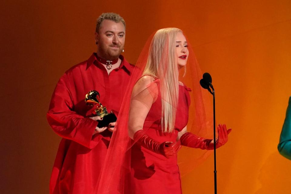 Kim Petras, right, and Sam Smith accept the award for best pop duo/group performance for Unholy at the 65th annual Grammy Awards  (Chris Pizzello / AP)