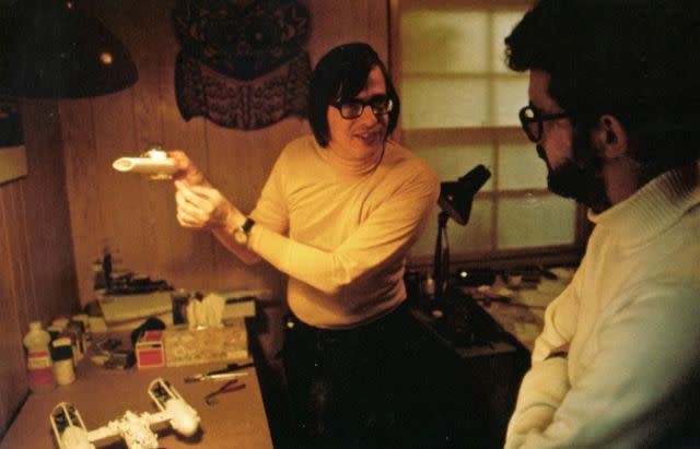 Cantwell showing some of his model designs—in this case a Y-Wing—to George Lucas during the development of the first Star Wars