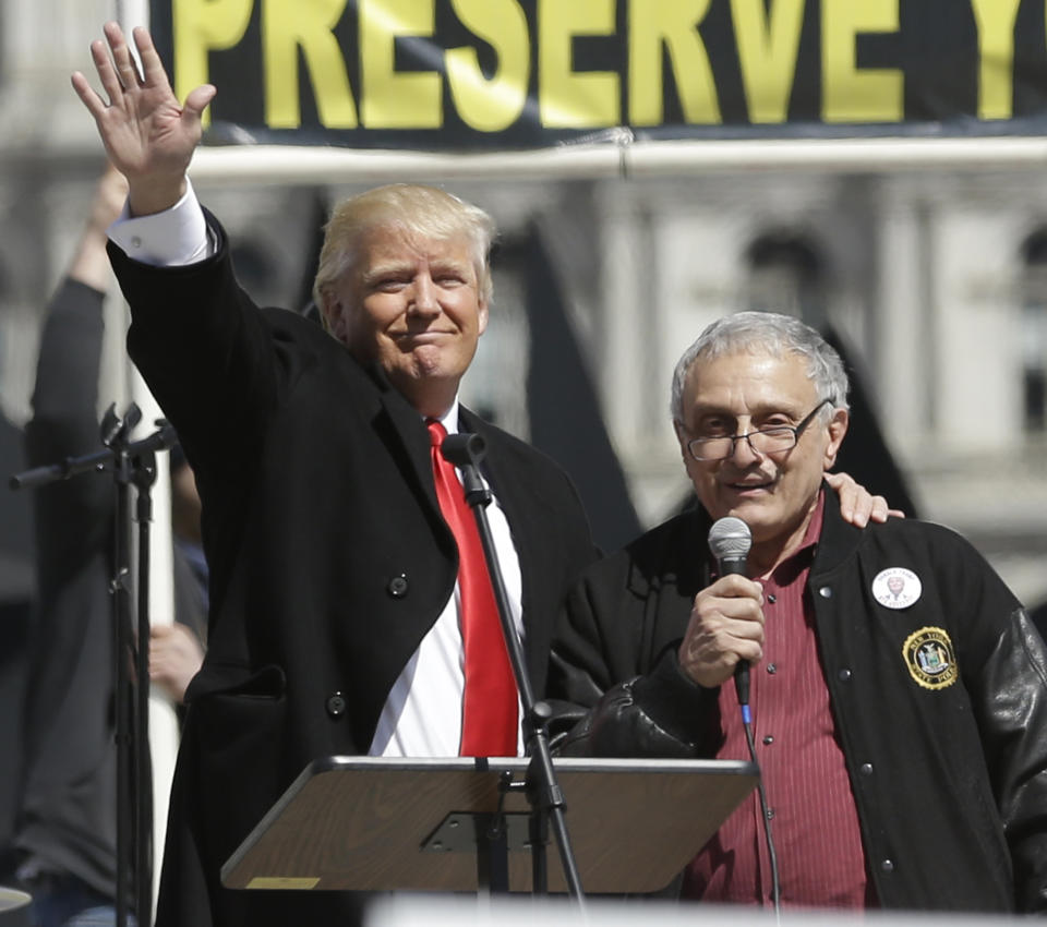 Donald Trump, left, and Carl Paladino, who ran for governor of New York as a Republican in 2010, speak during a gun rights rally at the Empire State Plaza on Tuesday, April 1, 2014, in Albany, N.Y. Activists are seeking a repeal of a 2013 state law that outlawed the sales of some popular guns like the AR-15. The law championed by Gov. Andrew Cuomo has been criticized as unconstitutional by some gun rights activists. (AP Photo/Mike Groll)