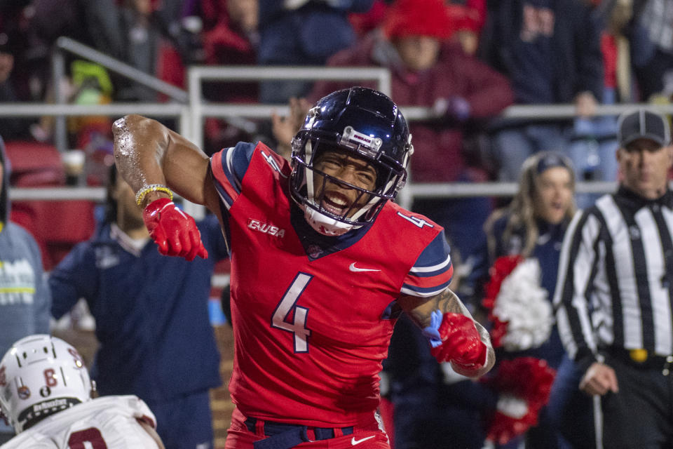 Liberty's CJ Daniels celebrates after a reception against New Mexico State during the second half of the Conference USA championship NCAA college football game Friday, Dec. 1, 2023, in Lynchburg, Va. (AP Photo/Robert Simmons)