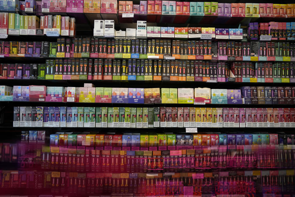 Disposable flavored electronic cigarette devices are displayed for sale at Vapes N Smoke in Pinecrest, Fla., Monday, June 26, 2023. Since 2020, the number of different e-cigarette devices for sale in the U.S. has exploded to more than 9,000, a nearly three-fold increase driven almost entirely by a wave of disposable vapes from China. (AP Photo/Rebecca Blackwell)