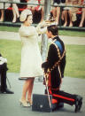 <p>The Queen crowns Charles during his investiture ceremony to become Prince of Wales, at Caernarvon Castle.</p>