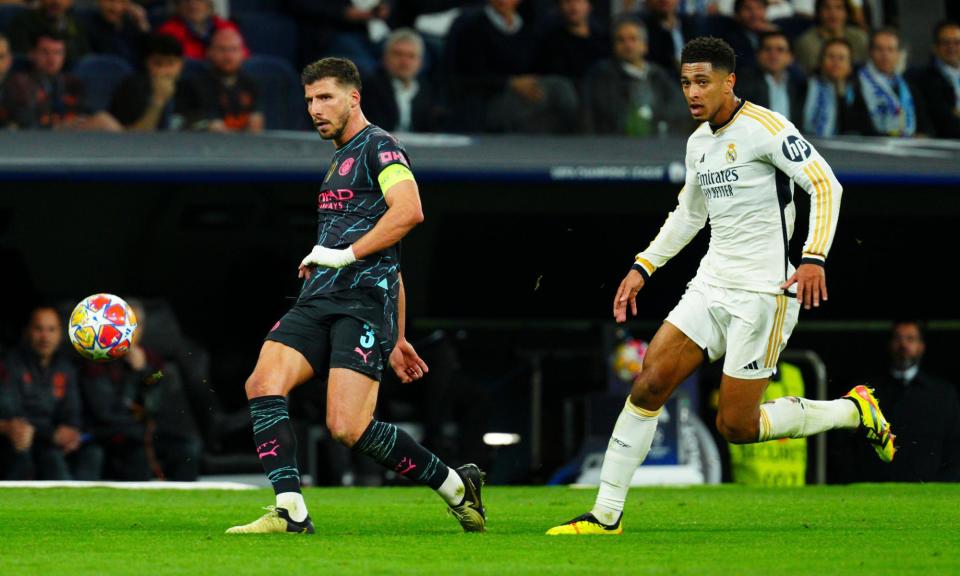 <span>Jude Bellingham pursues Rúben Dias in the first leg in Madrid.</span><span>Photograph: Javier García/Shutterstock</span>