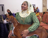 In this Tuesday, Feb. 4, 2020 photo, Aliya Taylor shows an Azawakh at the Westminster Dog Show preview in New York. Competition begins Saturday, Feb. 8, 2020 with the agility event that's open to mutts and everyone else. Breed judging for beagles, whippets and the newly welcomed Azawakh in the purebred portion of the show starts Sunday. (AP Photo/Jennifer Peltz)
