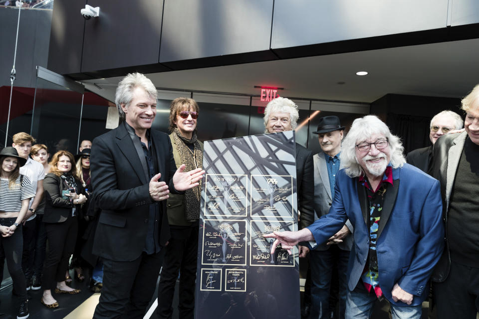 FILE - Jon Bon Jovi, left, Richie Sambora, and Graeme Edge, are seen at Hall of Fame Dedication at the Rock & Roll Hall of Fame on April 13, 2018 in Cleveland. Edge, a drummer and co-founder of The Moody Blues, has died. He was 80. The band’s frontman, Justin Hayward, confirmed Edge’s death Thursday, Nov. 11, 2021, on the group’s website. The cause of his death has not been revealed. Hayward called Edge the backbone of the British rock band. The band's last album was released in 2003. (Photo by Michael Zorn/Invision/AP, File)