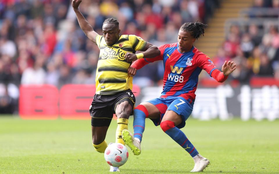 Hassane Kamara of Watford FC battles for possession with Michael Olise of Crystal Palace during the Premier League match between Crystal Palace and Watford - GETTY IMAGES