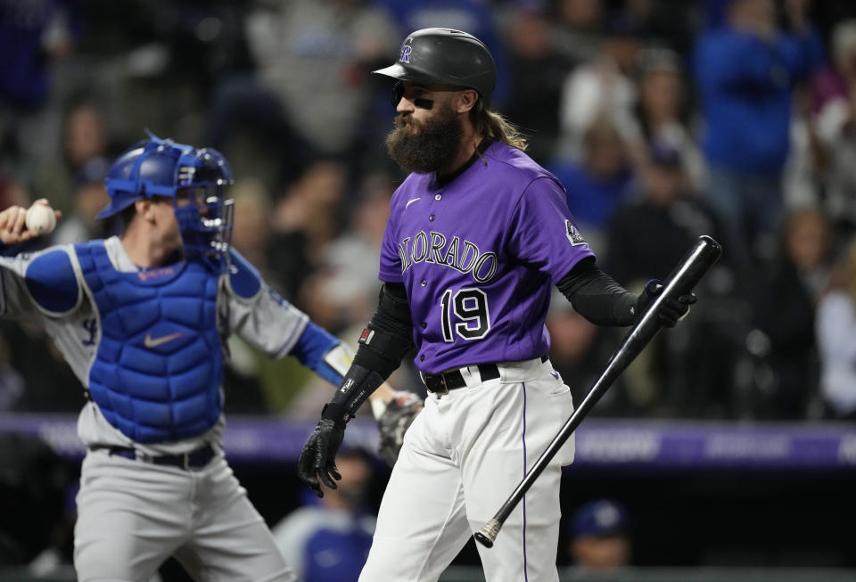 Colorado Rockies' Charlie Blackmon reacts after striking out with the bases loaded against Los Angeles Dodgers relief pitcher Blake Treinen to end the seventh inning of a baseball game Tuesday, Sept. 21, 2021, in Denver. (AP Photo/David Zalubowski)