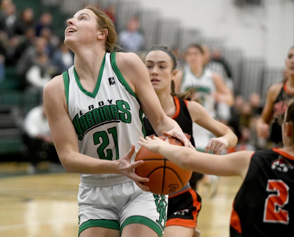 West Branch's Sophia Gregory pulls away the ball away from Chagrin Falls defenders to put in a basket in the first half of OHSAA Division II District Semifinals at Nordonia High School. Wednesday, February 28, 2024.
