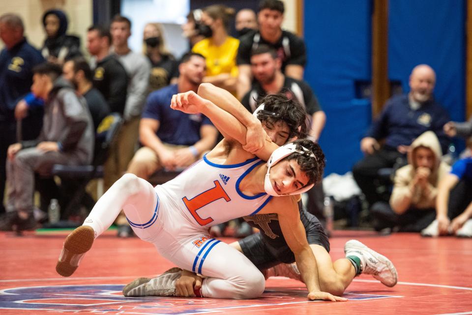 Day 1 of the Bergen County Wrestling Tournament at Hackensack High School on Saturday, January 22, 2022. Dylan Ross (Paramus Catholic) and Malik Asfour (Lodi) in their 113 pound match.