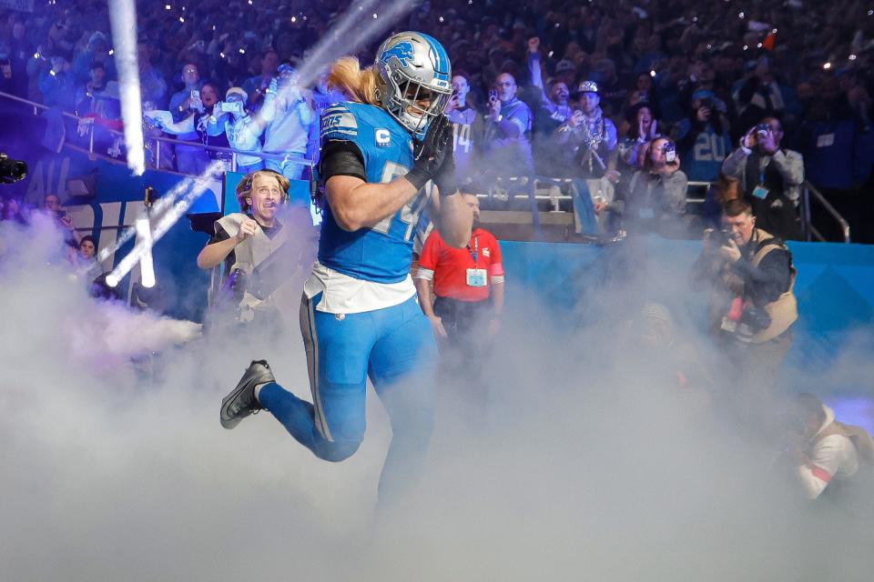 Detroit Lions linebacker Alex Anzalone (34) runs out of the tunnel for player introduction before kickoff against Tampa Bay Buccaneers at the first half of the NFC divisional round at Ford Field in Detroit on Sunday, Jan. 21, 2024.