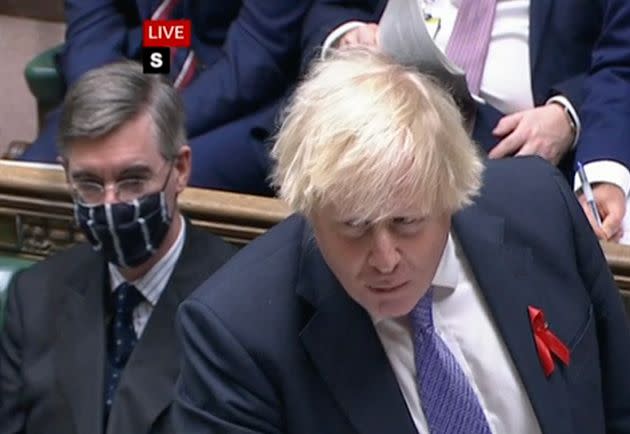 Jacob Rees-Mogg (left) with a mask (Photo: BBC Parliament)