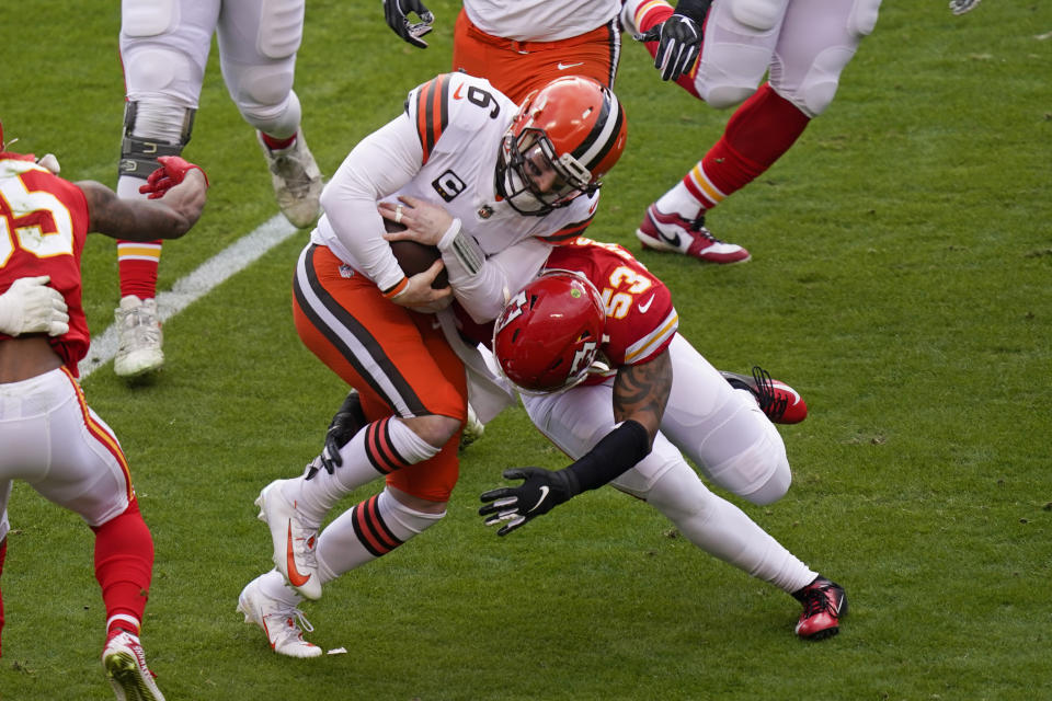 Cleveland Browns quarterback Baker Mayfield (6) is tackled by Kansas City Chiefs linebacker Anthony Hitchens (53) during the first half of an NFL divisional round football game, Sunday, Jan. 17, 2021, in Kansas City. (AP Photo/Orlin Wagner)