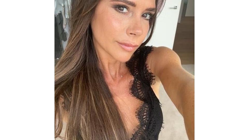 Victoria Beckham wearing plunging lace outfit in London home