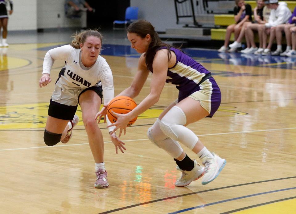 Calvary's Hannah Cail battles for the ball with Lumpkin County's Averie Jones during the 3A semifinals on Friday March 3, 2023 at Fort Valley State University.