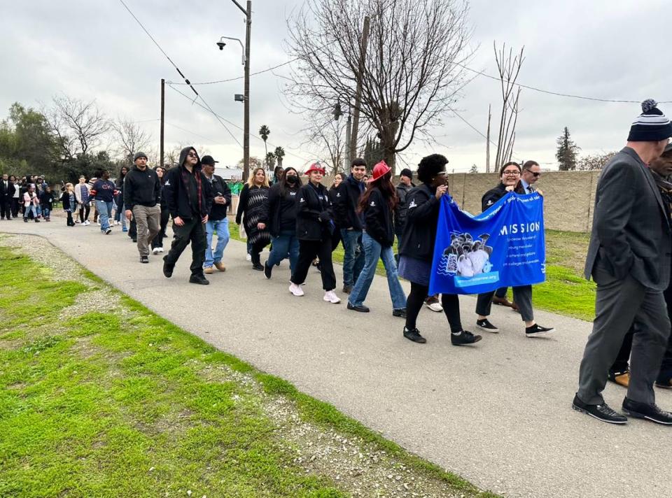 Local organizations join the march around the King-Kennedy Center for Dr. Martin Luther King Jr. Day on Monday afternoon. Taylor Johnson/tjohnson@modbee.com