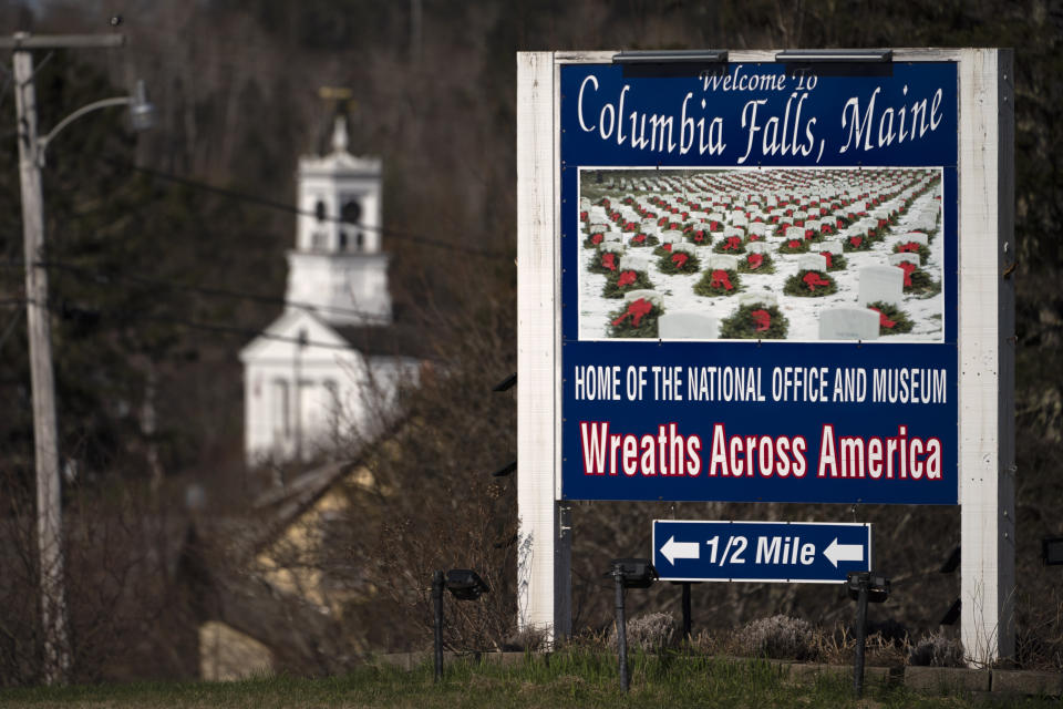 A sign welcomes visitors to Columbia Falls, Maine Friday, April 28, 2023. (AP Photo/Robert F. Bukaty)