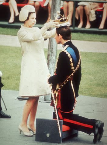 Hulton Archive/Getty Queen Elizabeth crowns Prince Charles during the July 1, 1969 investiture in Wales.