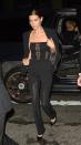 <p>In a black strapless jumpsuit with lace panels, a black blazer, patent leather pumps, a diamond necklace, hoop earrings and layered silver rings while out in NYC.</p>