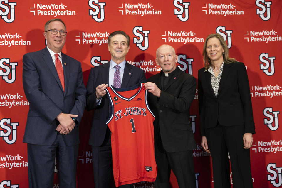 From left, St. John's Athletic Director Michael Cragg, new NCAA college basketball head coach Rick Pitino, University President Rev. Brian J. Shanley, and Big East commissioner Val Ackerman pose after Pitino was introduced at Madison Square Garden in New York, Tuesday, March 21, 2023. (AP Photo/Corey Sipkin)