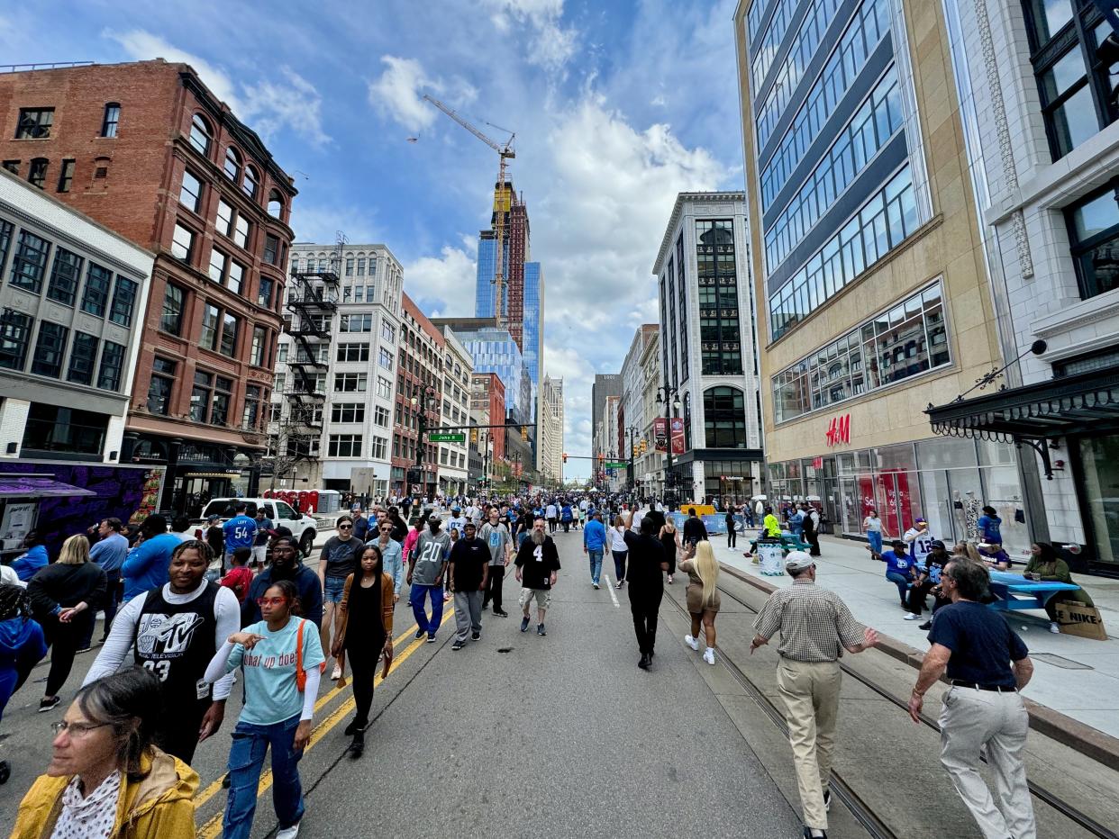 People in the streets of Detroit the weekend of the 2024 NFL Draft.